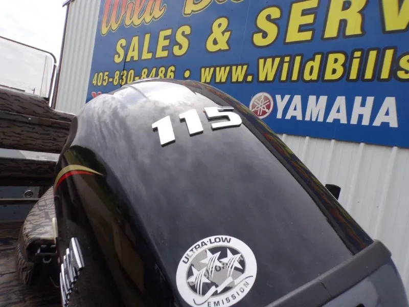 Slide: The Image of 2025 Xpress H20BAY boat engine with ultra-low emission sticker, displayed at Wild Bill's Sales. - 2