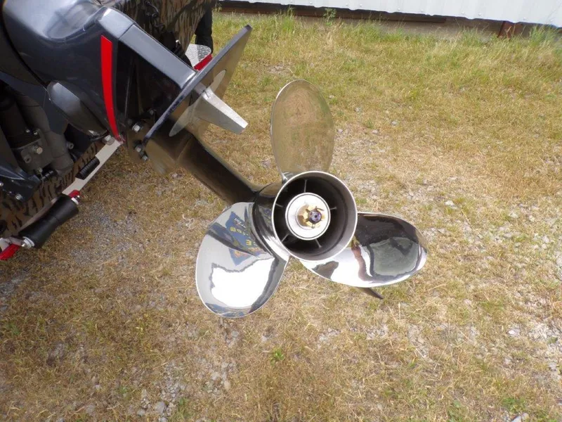 Slide: The Image of Propeller of 2025 Xpress H20BAY boat on grassy ground. - 23