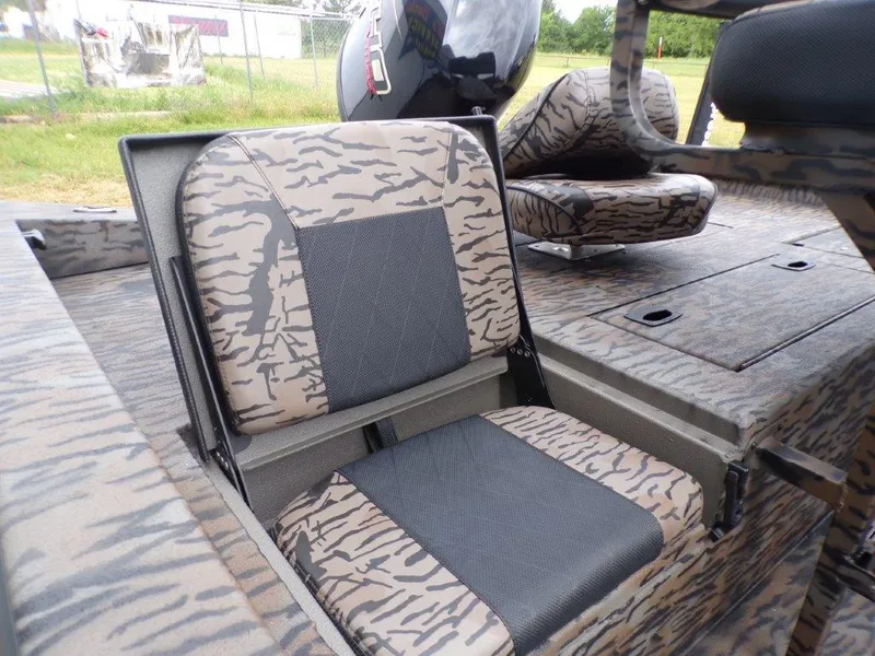 Slide: The Image of 2025 Xpress H20BAY boat seats with camouflage pattern and storage compartments. - 3