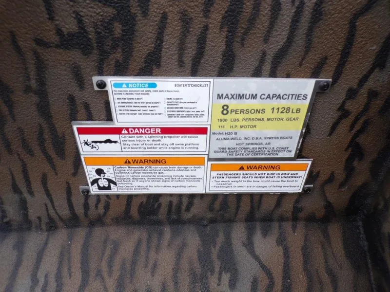 Slide: The Image of Safety and capacity labels on 2025 Xpress H20BAY boat, maximum 8 persons, 1128 lbs. - 8