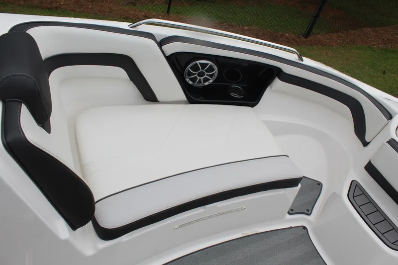 Slide: The Image of 2019 Yamaha Boats 242 Limited S interior seating with sleek design and speaker system. - 12