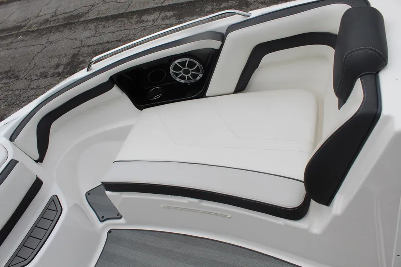 Slide: The Image of 2019 Yamaha Boats 242 Limited S interior seating with sleek white and black design. - 13