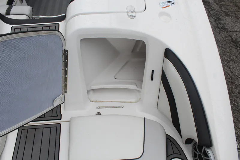 Slide: The Image of Open storage compartment on a 2019 Yamaha Boats 242 Limited S. - 14