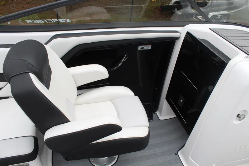 Slide: The Image of 2019 Yamaha Boats 242 Limited S interior with sleek black and white seating. - 4