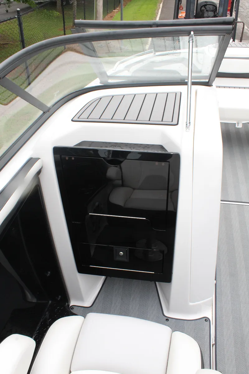 Slide: The Image of 2019 Yamaha Boats 242 Limited S interior with sleek black and white design. - 5