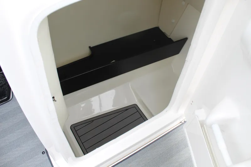 Slide: The Image of 2019 Yamaha Boats 242 Limited S storage compartment interior. - 6