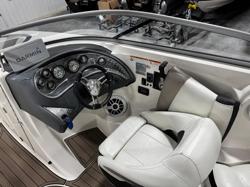 Slide: The Image of Cockpit of 2012 Larson LXi 288 boat with Garmin navigation system. - 11