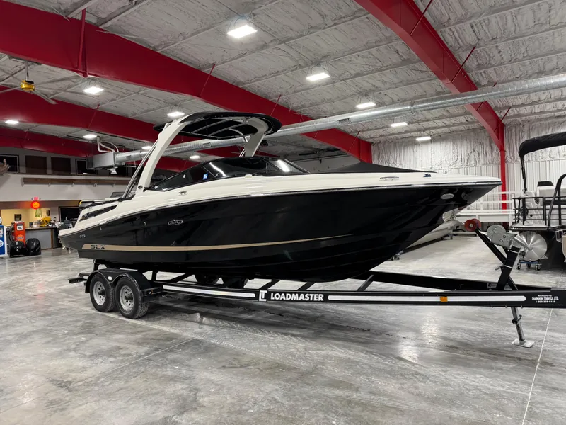 Slide: The Image of 2012 Sea Ray 250 SLX boat on Loadmaster trailer in indoor storage facility. - 13