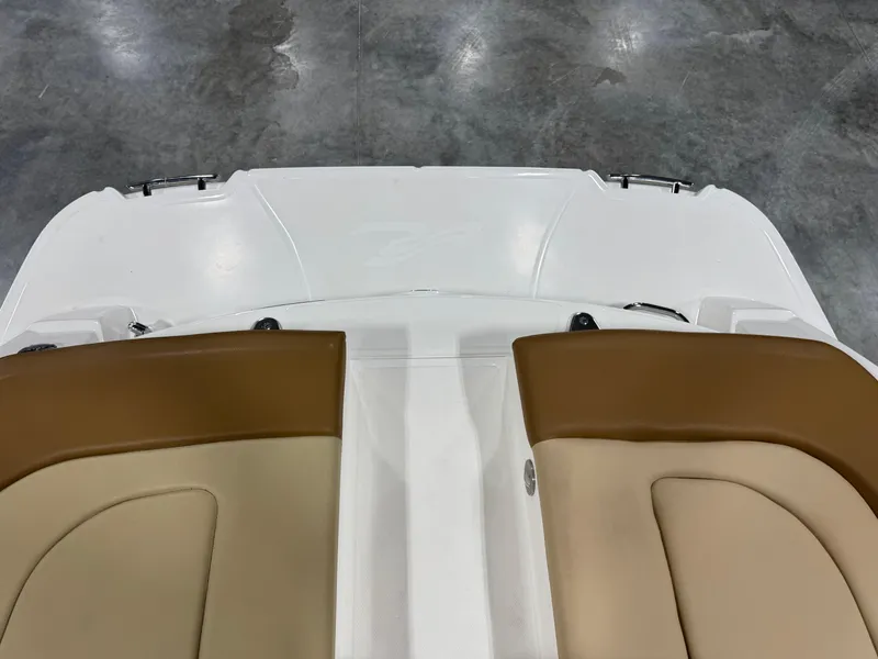 Slide: The Image of 2012 Sea Ray 250 SLX boat interior with tan and cream seating. - 7