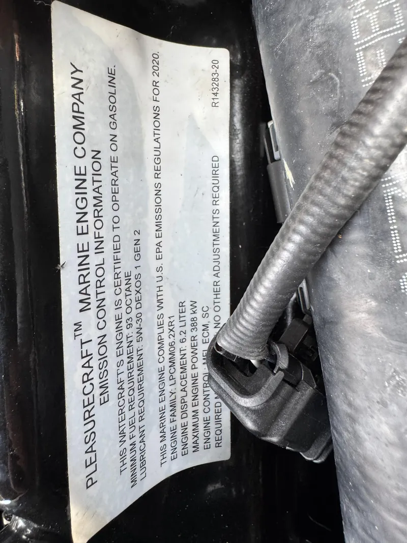 Slide: The Image of Label on a 2014 Correct Craft G23 engine, detailing emission control information. - 17