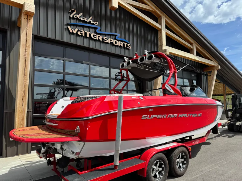Slide: The Image of Red 2014 Correct Craft G23 boat at Idaho Water Sports dealership. - 3