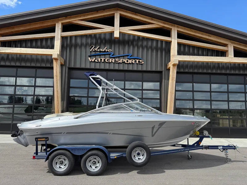 Slide: The Image of 2006 Four Winns Horizon boat on trailer at Idaho Water Sports facility. - 2