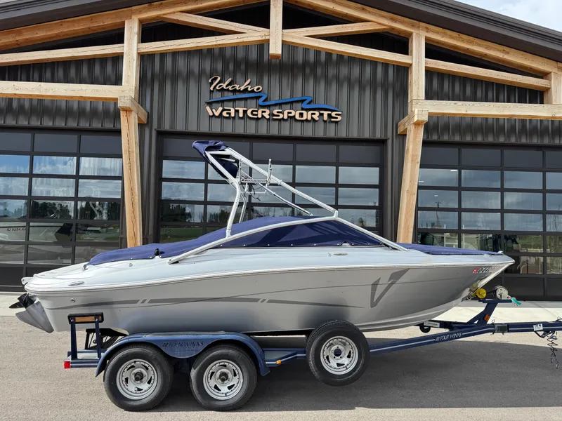 Slide: The Image of 2006 Four Winns Horizon boat on trailer at Idaho Water Sports facility. - 3