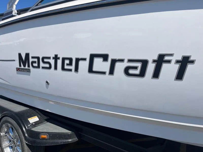 Slide: The Image of 2008 MasterCraft X35 boat side view with logo and trailer. - 15