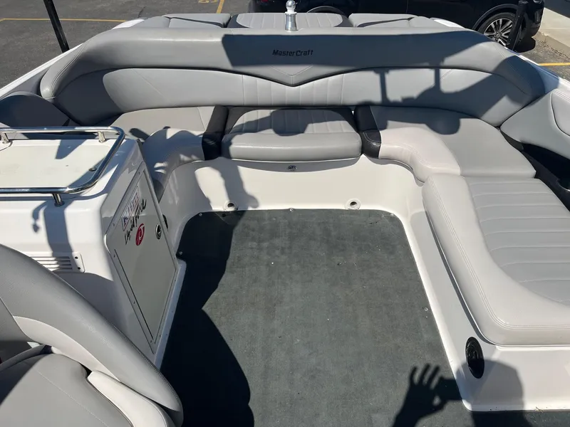 Slide: The Image of 2008 MasterCraft X35 boat interior with gray seating and carpeted floor. - 20