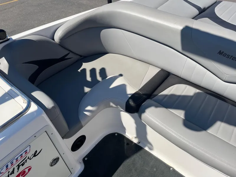 Slide: The Image of 2008 MasterCraft X35 boat interior with gray seating and logo detail. - 22