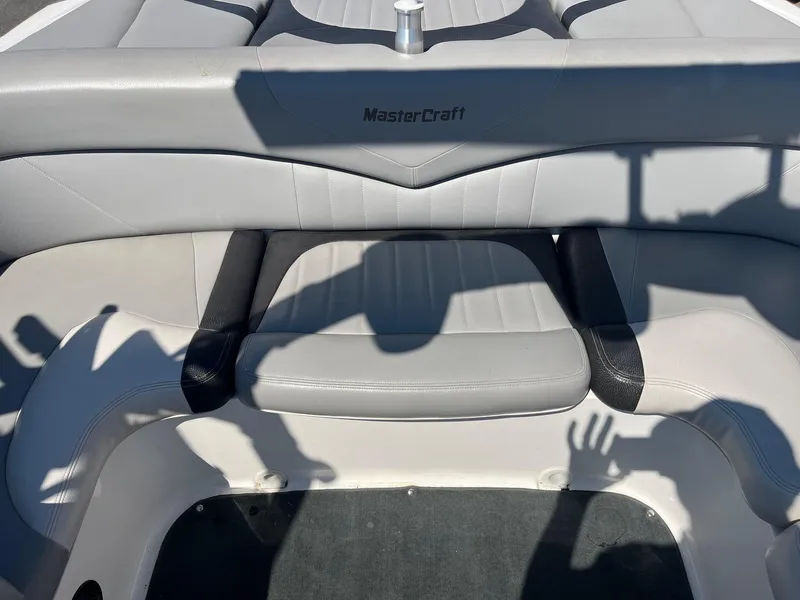 Slide: The Image of 2008 MasterCraft X35 boat interior with gray seating and visible shadows. - 23