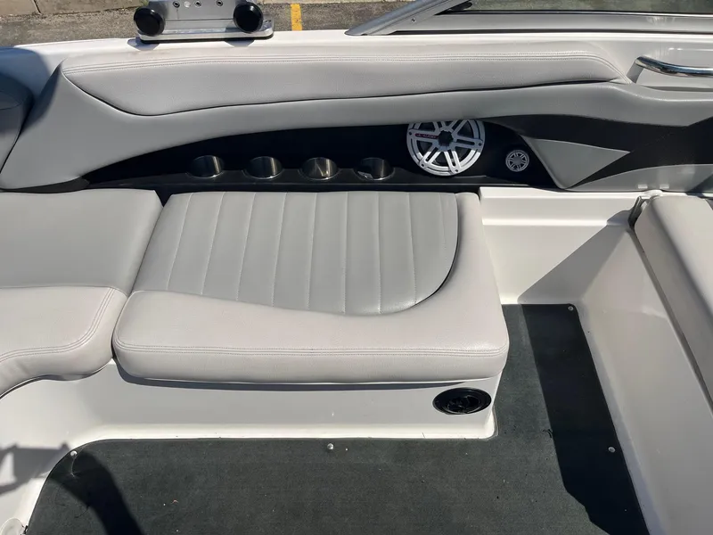Slide: The Image of 2008 MasterCraft X35 boat interior with gray seating and speaker system. - 25