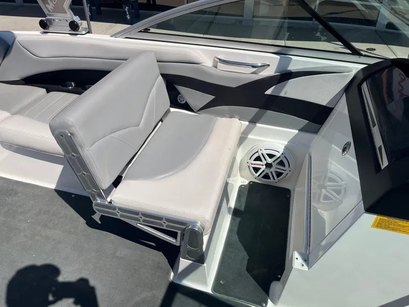 Slide: The Image of 2008 MasterCraft X35 boat interior with gray seating and speaker system. - 26