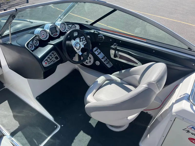 Slide: The Image of 2008 MasterCraft X35 boat interior with modern dashboard and steering wheel. - 27