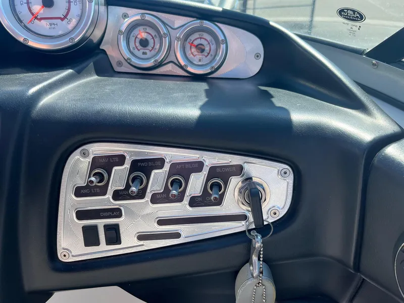 Slide: The Image of Dashboard controls of a 2008 MasterCraft X35 boat with key ignition. - 31