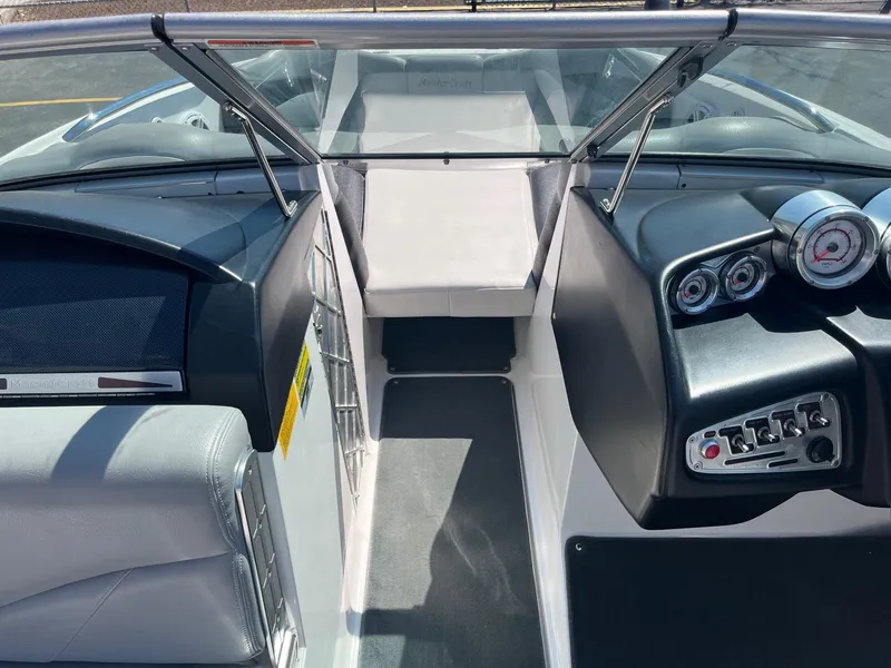 Slide: The Image of 2008 MasterCraft X35 boat interior with dashboard and seating area. - 33
