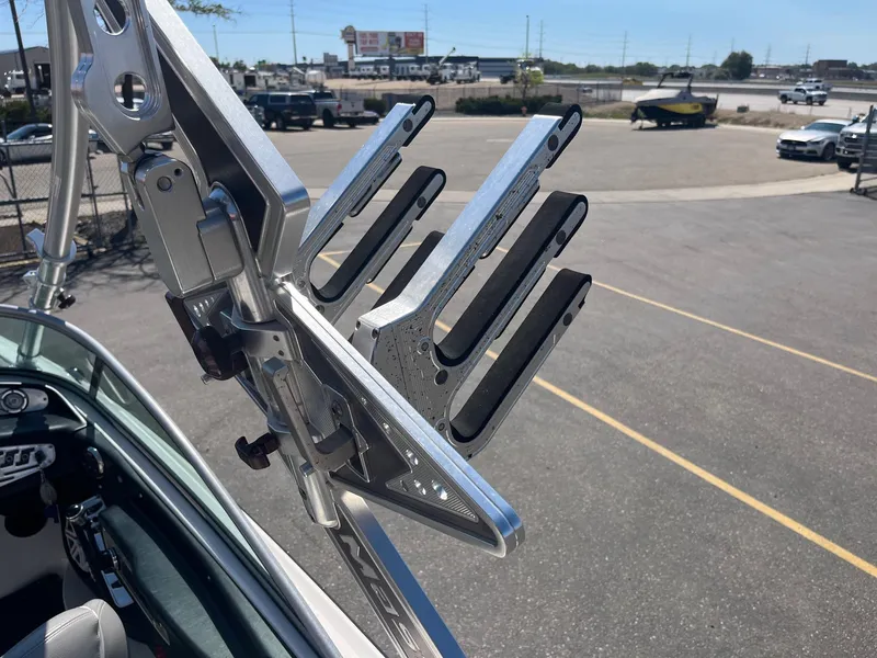 Slide: The Image of 2008 MasterCraft X35 wakeboard rack on a boat, parked in a lot. - 34