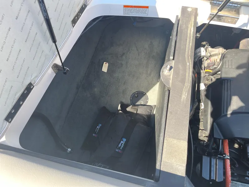 Slide: The Image of Open engine compartment of 2008 MasterCraft X35 boat, showing interior components. - 38