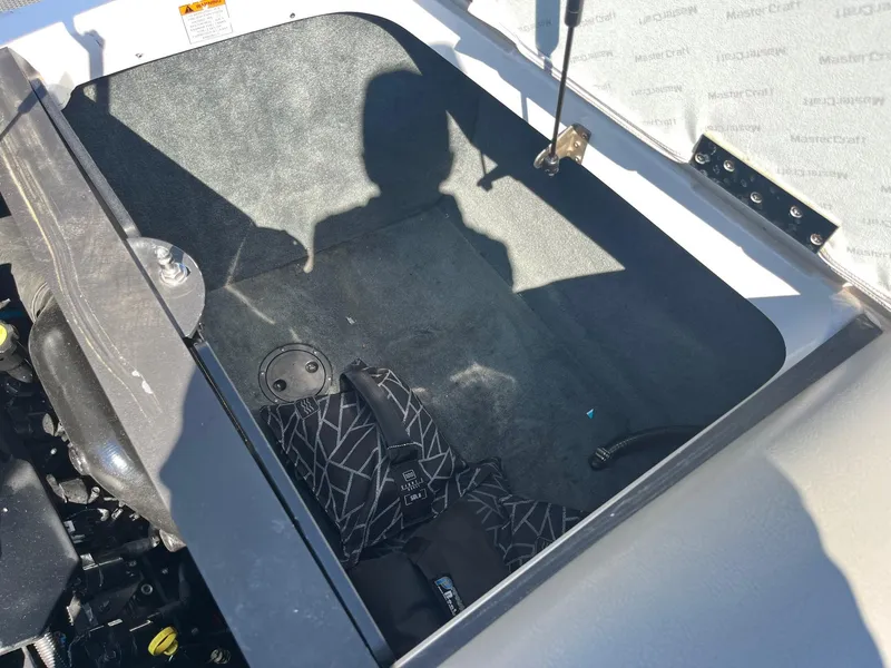 Slide: The Image of Open storage compartment in a 2008 MasterCraft X35 boat, showing interior details. - 39