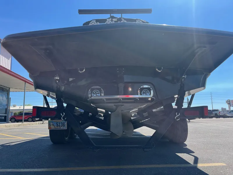 Slide: The Image of Rear view of a 2008 MasterCraft X35 boat on a trailer in a parking lot. - 6