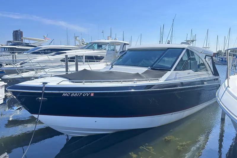 The Image of 2023 Formula 380 Super Sport Crossover OB docked in a marina. - 0