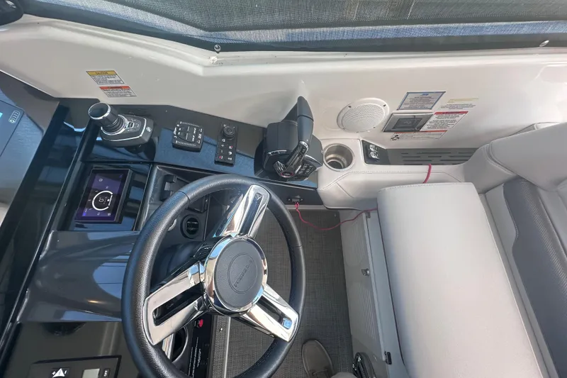 Slide: The Image of 2023 Formula 380 Super Sport Crossover OB cockpit with modern controls and steering wheel. - 17