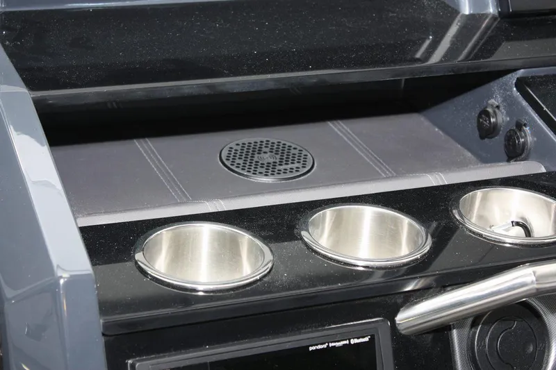Slide: The Image of 2023 Formula 380 Super Sport Crossover OB dashboard with cup holders and speaker. - 19
