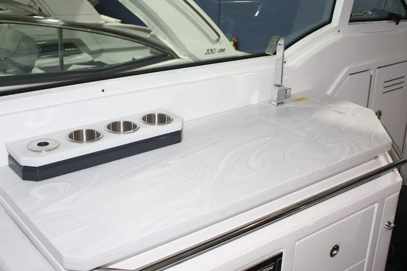 Slide: The Image of 2023 Formula 380 Super Sport Crossover OB interior with sleek countertop and cup holders. - 30