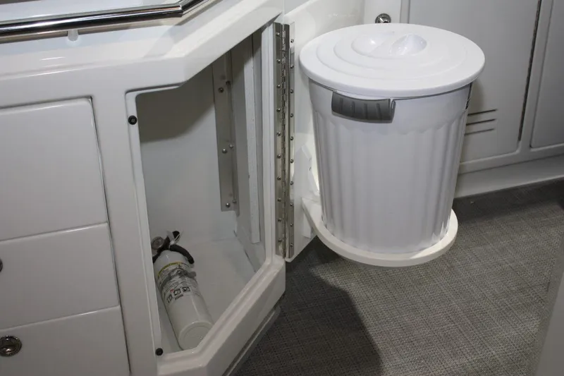 Slide: The Image of 2023 Formula 380 Super Sport Crossover OB interior with trash bin and fire extinguisher. - 31