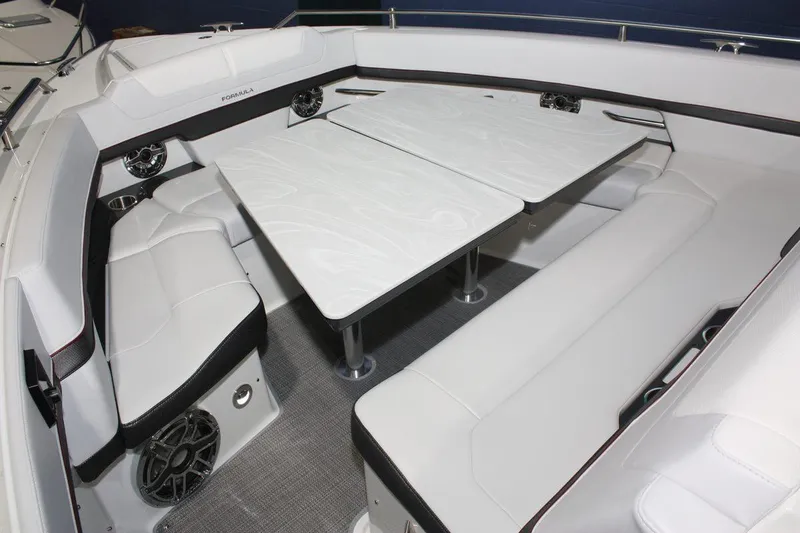 Slide: The Image of 2023 Formula 380 Super Sport Crossover OB interior with white seating and tables. - 33