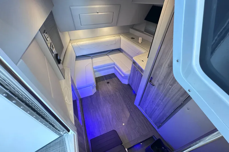 Slide: The Image of 2023 Formula 380 Super Sport Crossover OB cabin interior with modern seating and ambient lighting. - 41