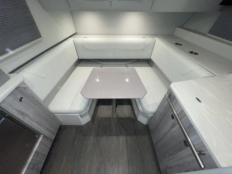 Slide: The Image of 2023 Formula 380 Super Sport Crossover OB interior with modern seating and table. - 42