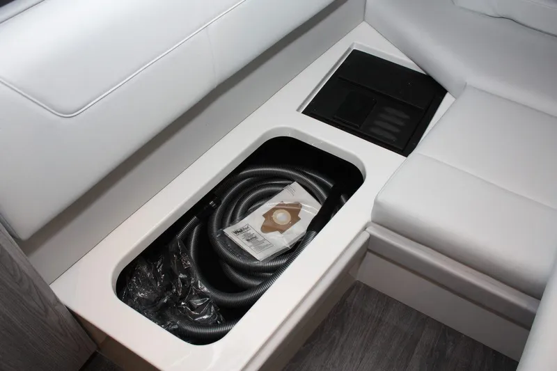 Slide: The Image of 2023 Formula 380 Super Sport Crossover OB interior storage compartment with hose and accessories. - 45