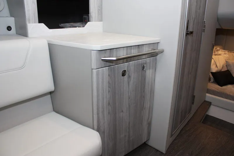 Slide: The Image of 2023 Formula 380 Super Sport Crossover OB interior with modern cabinetry and seating. - 49
