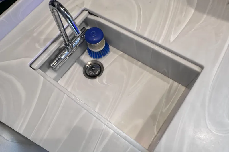 Slide: The Image of Modern sink with chrome faucet and blue brush on Formula 380 Super Sport Crossover OB, 2023. - 51