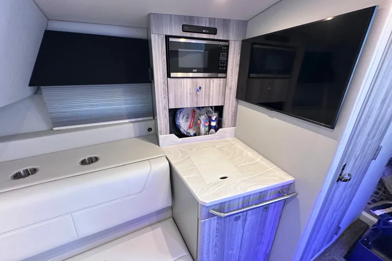 Slide: The Image of 2023 Formula 380 Super Sport Crossover OB interior with kitchenette and seating area. - 76