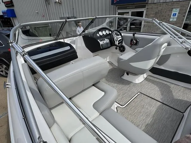 Slide: The Image of 2019 Regal 1900 ES boat interior with modern dashboard and seating. - 10