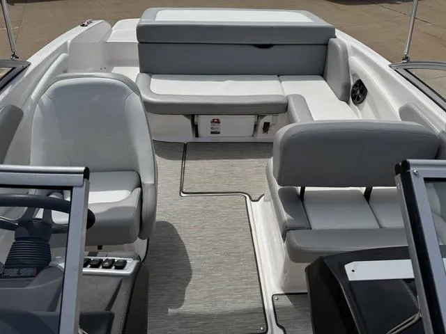 Slide: The Image of 2019 Regal 1900 ES boat interior with gray seating and modern design. - 11
