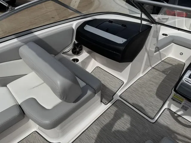 Slide: The Image of Interior of 2019 Regal 1900 ES boat with gray seating and modern dashboard. - 14