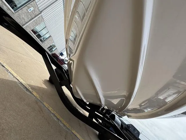 Slide: The Image of 2019 Regal 1900 ES boat on trailer, parked outside a building. - 17