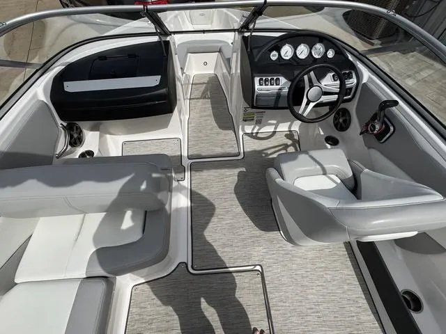 Slide: The Image of 2019 Regal 1900 ES boat interior with modern dashboard and seating. - 9