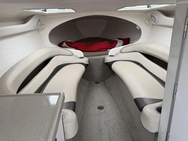 Slide: The Image of Interior of a 2000 Baja 36 Outlaw boat with sleek seating and modern design. - 14