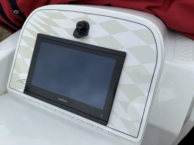 Slide: The Image of Garmin display on 2000 Baja 36 Outlaw boat dashboard with geometric pattern. - 19