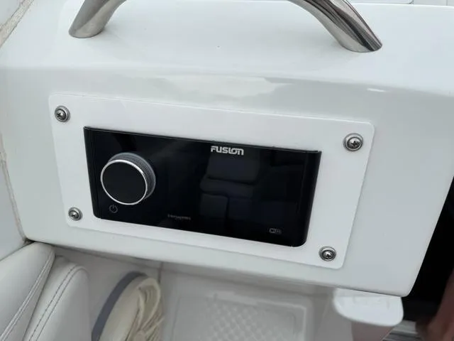 Slide: The Image of Control panel of a 2000 Baja 36 Outlaw boat with Fusion audio system. - 20